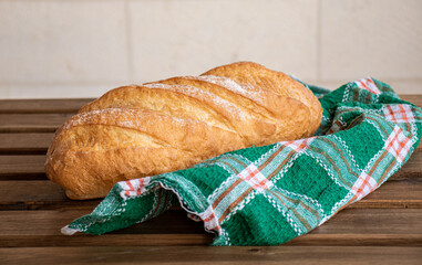 Bread on wooden table ready to be served with white background
