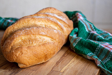Bread on wooden table ready to be served with white background
