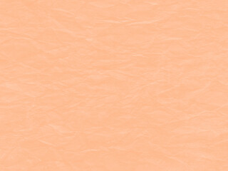 A delicately creased sheet of paper in the trendy shade Peach Fuzz. Colour of the year 2024. 