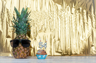 Cheerful pineapple in glasses festive happy birthday character with number  54. Beautiful...