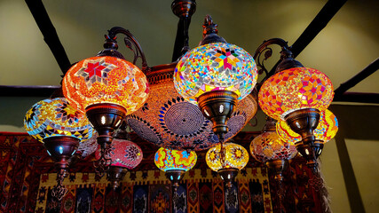 Various turkish or arab lights at the roof ceiling.