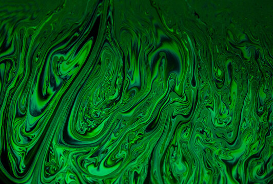 Abstract green liquid swirling pattern