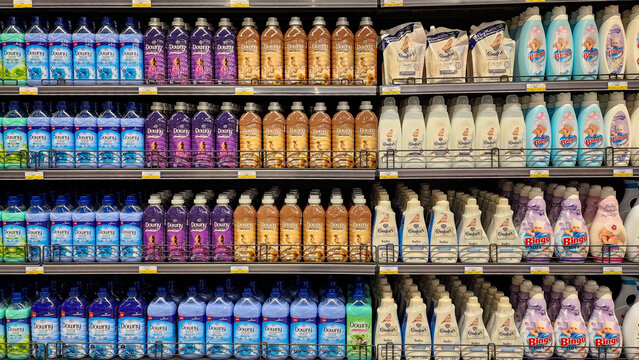 Various Fabric softeners at a shelf of supermarket.