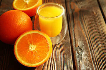 Fresh ripe juicy oranges on light background