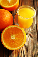 Fresh ripe juicy oranges on light background