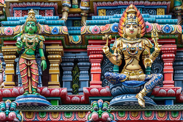 Colored decorations and statues on the exterior of the Hindu Temple Sri Maha Mariamman Temple ("Wat Phra Si Maha Umathewi") on Si Lom Road in Bangkok, Thailand. Built in1879.
