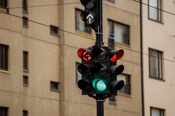 Traffic lights with direction arrows on the lights showing directions allowed to drive
