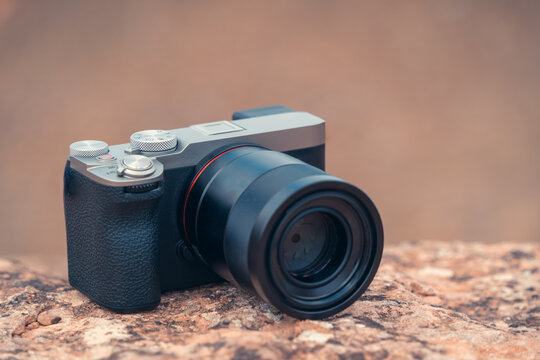 Digital camera of tourist placed on rough surface