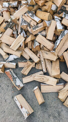 A mountain of firewood. Chopped firewood for the winter. birch firewood. a lot of firewood - harvesting wood for heating the house