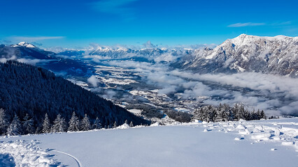 Panoramic view of ski resort Dreilaendereck in Karawanks, Carinthia, Austria. Alpine landscape in winter Austrian Alps. Looking at snow capped mountains. Skiing tourism. Ski slope in winter wonderland