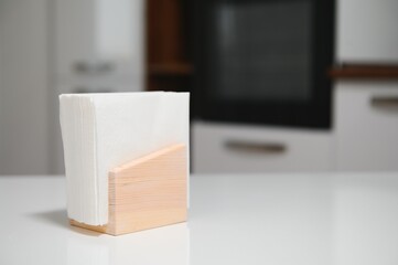Wooden napkin holder in kitchen