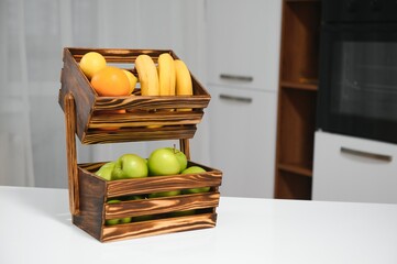 handmade kraft box with fruits and vegetables on kitchen background.