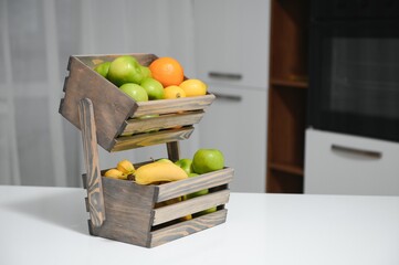 handmade kraft box with fruits and vegetables on kitchen background.