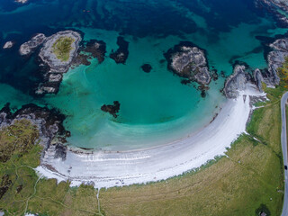 Blue , transparent and clear water Scotland uk near Arisaig Scottish Highlands beautiful white sandy beach Scottish tourist destination located south of Mallaig
