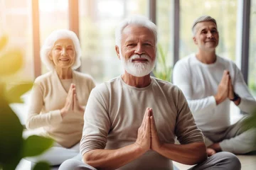 Fotobehang pensioners, old age, elderly people, nursing home, fitness center, sports, yoga, fitness, namaste, relaxation, together, group exercise, lifestyle, active pensioners, woman, meditating, sitting, exerc © Kate