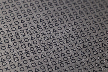 Pattern of symbols and signs on a flat grey surface