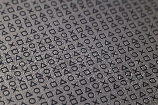 Pattern of symbols and signs on a flat grey surface