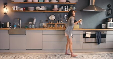 Woman, dancing and kitchen with coffee, morning and music in home with fun. Happy, tea and hot drink in a house with pyjamas with cup, excited and freedom from audio and song at breakfast with energy