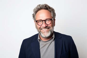 Handsome middle-aged man with grey beard and glasses.