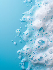 splash of foam from soap or shampoo on blue background