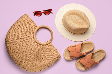 Composition with beach accessories on lilac background