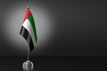 Small United Arab Emirates Flag in Front of Black Background, 3d Rendering