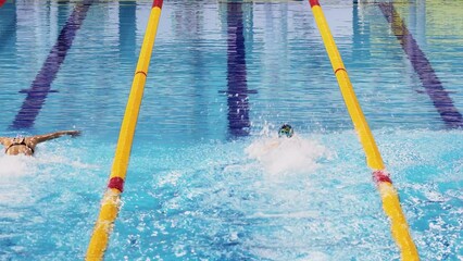  Sportswomen swim butterfly stroke by tracks of Burevestnik basin during All Russia Swimming Competition, Alexander Popov Cup