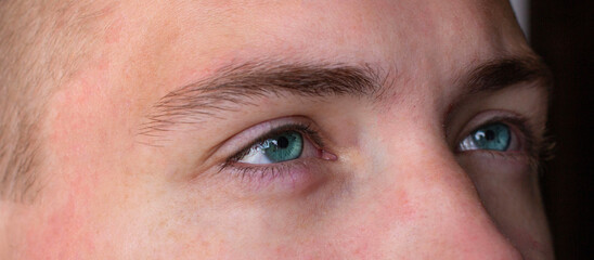 Close-up of a man's eyes. A man with blue eyes.