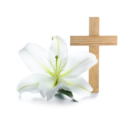 Lily flower and wooden cross on white background