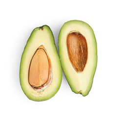 Halves of fresh ripe avocado on white background