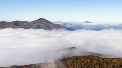 Beautiful view above the mountains of the Basque Country. with a stunning sea of clouds. Spain.