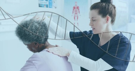 Animation of dna strand over diverse female physiotherapist and senior female patient - Powered by Adobe