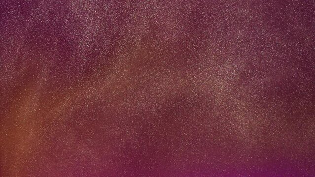 colorful luminous particles shimmer in blue liquid. Abstract digital particle wave and light abstract background. Floating particals in ocean.