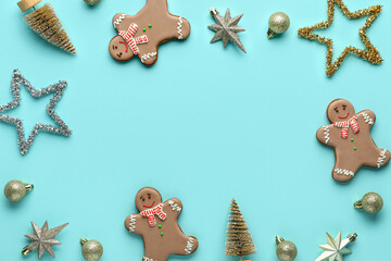 Fototapeta na wymiar Frame made of gingerbread cookies with Christmas decor on blue background