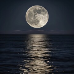 A full moon is seen over the ocean.