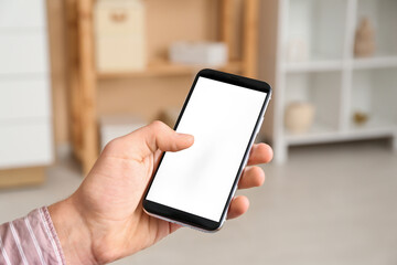 Young man using mobile phone on online date at home, closeup