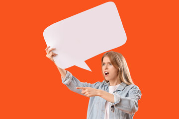 Young woman with blank speech bubble pointing at something on orange background. Accusation concept