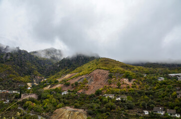 The autumn landscape from the walls of the Akhtala Monastery to the mountain slope is covered with...