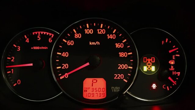 Moving arrow of tachometer on car dashboard with red backlight