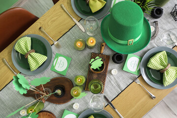 Festive table serving with leprechaun's hat and decorations for St. Patrick's Day celebration, top view