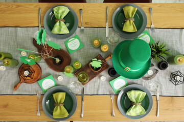 Festive table serving with leprechaun's hat and decorations for St. Patrick's Day celebration, top...