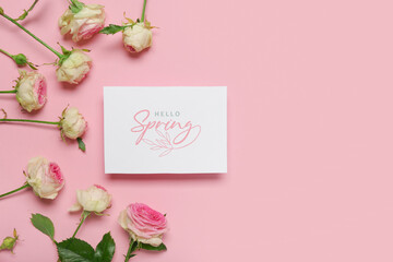 Greeting card with text HELLO SPRING and beautiful roses on pink background