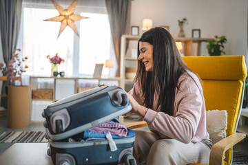 One woman pack suitcase baggage prepare for vacation holiday