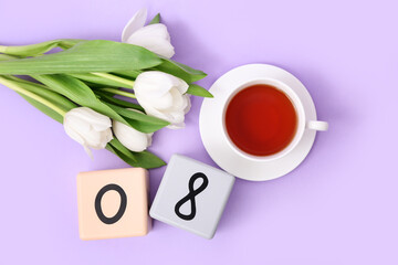 Cube calendar with date 08, beautiful white tulips and cup of tea on lilac background. International Women's Day