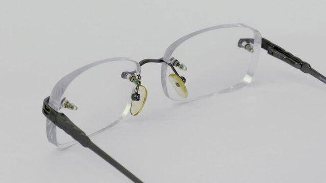 Circling plastic bifocal glasses isolated on white