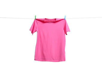 Pink t-shirt drying on washing line against white background