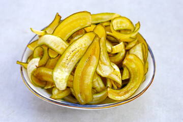 Banana chips, fried slices banana with green peel
