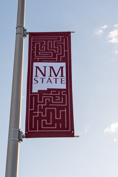 Las Cruces, NM - Oct. 12, 2021: New Mexico State University banner. NMSU is a NASA Space-Grant College and home to the very first Honors College in New Mexico.