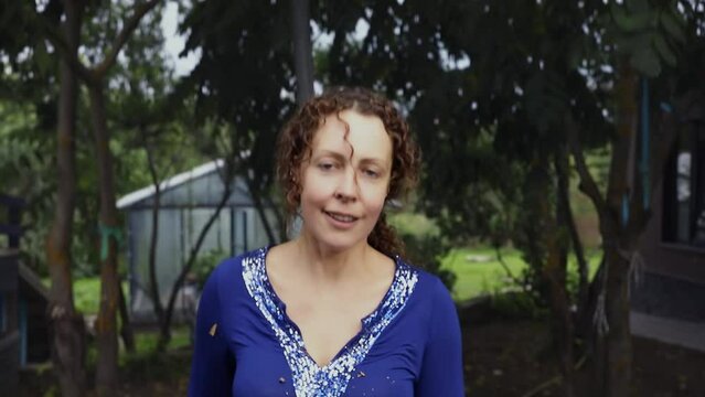 Face of young smiling woman which jumps on trampoline. Slow motion
