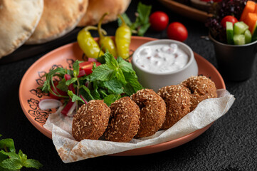Felafel with sauce dip and bread